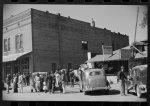 [Untitled photo, possibly related to: Some of the Negroes watching itinerant salesman selling goods from his truck in center of town. On Saturday afternoon. Belzoni, Mississippi Delta, Mississippi]