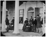 [Fort Monroe, Va. Officers and ladies on porch of a garrison house]