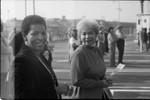 Two women posing together at the opening of the Martin Luther King Jr. Shopping Center, Los Angeles, 1984