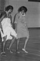 Viola Bradford learning a traditional African dance in a gymnasium, probably in Montgomery, Alabama..