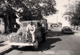 Man Sitting on Hood of Truck