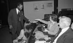 An actor collecting tithes during a performance of "Amen Corner," Los Angeles, 1983