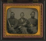 [Three unidentified soldiers in Union uniform with swords and revolver]