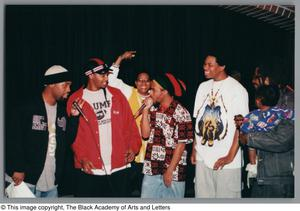 Photograph of two men rapping into their microphones