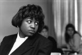 A student listens to her peers during a classroom discussion, circa 1990