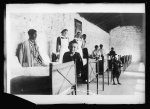 Saving Montenegro's Starving War Orphans. In a sunny hospital ward at Podgoritza, Junior Red Cross nurses are saving many war orphans of Montenegro. The little boy, a tubercular, in the aisle has a stunt that pleases and amuses every hospital visitor. He salutes gravely to welcome the newcomer. The nurses here shown are Miss Minnie T. Buelhauser of N.Y.C., &amp; Miss H.A. Wiltzius of Chicago