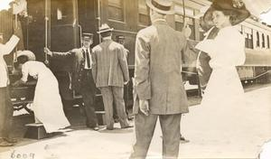 People boarding a passenger train