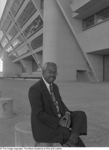 Photograph of Fred L. Blair seated in front of Dallas City Hall