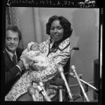 Congresswoman Yvonne Brathwaite Burke and husband William presenting newborn daughter Autumn to reporters in Los Angeles, Calif., 1973