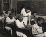 African American teacher and students in an adult literacy class sponsored by the WPA in Birmingham, Alabama.