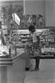 Young woman looking at merchandise in a case at the H. L. Green Department Store on Dexter Avenue in Montgomery, Alabama.