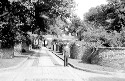 Thumbnail for Charlottesville area including the University of Virginia. Jackson Davis standing in alleyway between Pavilion III and Pavilion V gardens