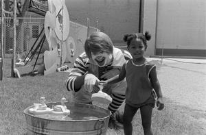 Ronald McDonald with a young girl