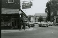 Student standing near Southside Sundry, Farmville, Va., July 1963