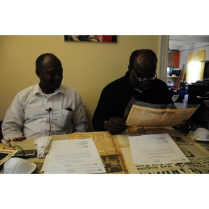 Stephen Hunter and David F. Hunter examine family artifacts