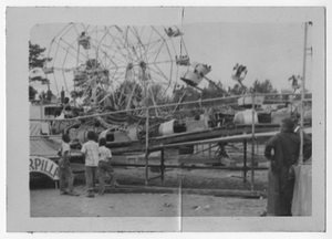 Photograph of children watching the rides at the fair, Manchester, Georgia, 1953