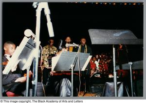 Thumbnail for Photograph of performers standing on a stage