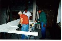 Men Painting a Fireplace Mantel inside the Stephenson House during resoration in the early 2000s