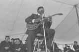 B. B. King: New Haven, Conn. Yale University Graduation. B. B. King at podium, performing at graduation ceremony (BKP 26-77-5/15)