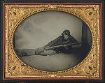 [Private Robert M. Burnard of Co. A, 47th Ohio Infantry Regiment reclining with rifle, bayonet, and bedroll]