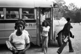 Students getting off Wilcox County school buses at the high school in Pine Hill, Alabama.