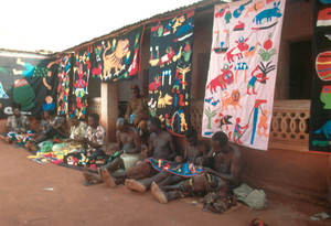 Appliqué workers, in street, Abomey, Benin