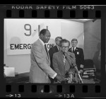 Los Angeles Mayor Tom Bradley and Councilman Marvin Braude flipping "on switch" for 911 emergency telephone system, 1984