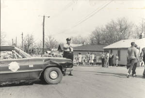 African American policeman directing marchers in Montgomery during the Selma to Montgomery March.