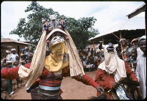 Masked dancers during a Gelede performance, Meko, Nigeria