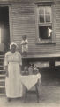 African American woman with jars of preserves.