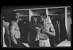 [Willie Mays talking with another African American baseball player in the New York Giants baseball team locker room]