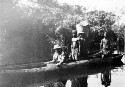 Crossing an African River by native canoe. Mr. Sibley in the boat. Miss Mong? and I had just crossed. Canoes made of hollowed out logs done by hand. Very sturdy but tippy! XXX