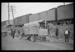 [Untitled photo, possibly related to: Day laborers being hired for cotton picking on Mississippi and Arkansas plantations. Between four and six-thirty every morning during the season, near the Hallan Bridge in Memphis, Tennessee, crowds of Negroes in the streets gather and are loaded into trucks by drivers who bid, and offer them anywhere from fifty cents to one dollar per day]