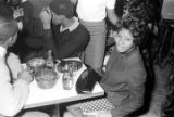 Barbara Howard Flowers, staff member at the Southern Courier, seated at a table at the Laicos Club in Montgomery, Alabama.