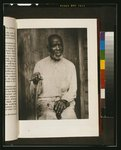 [African American man, three-quarter length portrait, seated, facing front, right hand holding cane, left hand on lap]