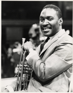 Herbie Jones holding trumpet : black-and-white photoprint.