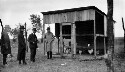 Guadalupe College. Chicken coop. Unidentifed men