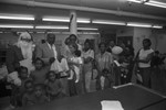 Black Track, Inc. food give-a-way participants posing for a group portrait, Los Angeles, 1990