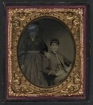 [Unidentified soldier in Union uniform with unidentified woman in dress]