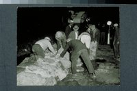 Hurricane of 1938: men piling sandbags, Colt dike, Hartford, September 22, 1938