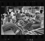 Distributing street cleaning supplies to Operation Youth in Los Angeles (Calif.)