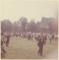 Protesters holding up signs in a park