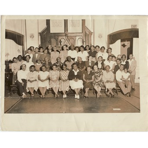 Reverend Fisher and Laymon Hunter, seated with congregation