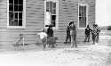 Caroline County Training School, Automobiles, Game of marbles on the side, Group of teachers (Lantern slide made)