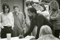 Oscar Walters surrounded by his students