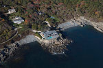 An October 2017 aerial view of homes high above the Atlantic Ocean on the rocky coast of Maine, near Bald Head Village