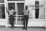 James "Son" Thomas and Joe Cooper, Leland, Mississippi. Street scene, cafe. (JTP 6-76-3)