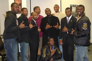 Group posing with hand signs during 2006 BHM