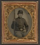 [Unidentified young soldier in Union uniform with musket, revolver, and cap box]