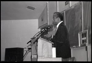 James Baldwin lecturing at UMass Amherst Baldwin standing at a podium with microphones